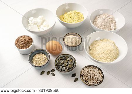 Ingredients For A Protein Bread With Quark, Oat Bran, Lupine Flour, Almond And Various Seeds In Bowl