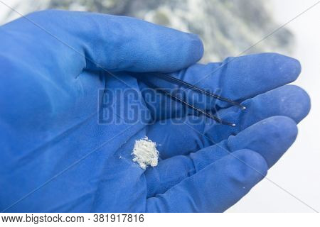 Chrysotile Asbestos Fibers Close-up On The Hand Of A Man In Gloves.