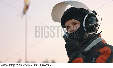 Paramotorgliding. Portrait Of A Man Removing Safety Helmet After Landing. High Quality Photo