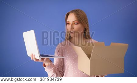 Satisfied Woman Customer Unpacking Delivery At Home. Online Shopping Concept. High Quality Photo Wit