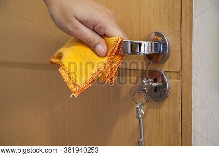 Cleaning The Door Handle For Coronavirus Prevention During Normal New Quarantine