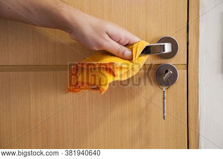 Cleaning The Door Handle For Coronavirus Prevention During Normal New Quarantine