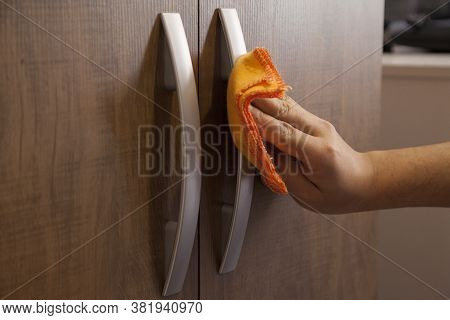 Cleaning The Door Handle For Coronavirus Prevention During Normal New Quarantine