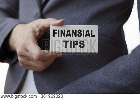 Business Woman Holds A Banner With The Inscription Finansial Tips. Business Concept.