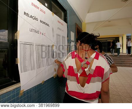 Eunapolis, Bahia / Brazil - November 6, 2010: People Look At Attendance List For Exams Of The Nation