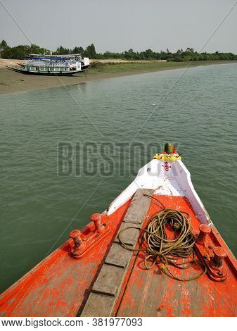 The Prow Of A Bright Red Fishing And Tourist Boat Sailing On The Bay Of Bengal