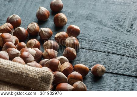 Hazelnuts, Filbert On Old Wooden Table. Heap Or Stack Of Hazel Nuts. Hazelnut Background, Healty Foo
