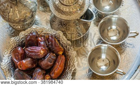 Ramadan Palm Fruit Dates In Silver Bowl And Zam Zam Water Symbolize Sacred Month For Muslims. Ramada