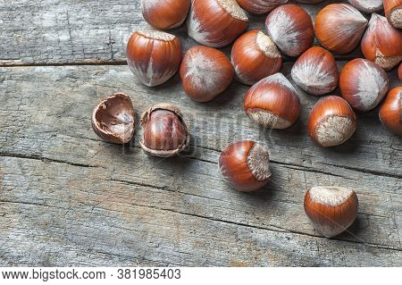 Hazelnuts, Filbert On Old Wooden Table. Heap Or Stack Of Hazel Nuts. Hazelnut Background, Healty Foo