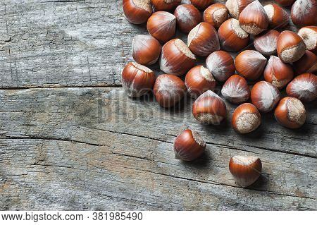 Hazelnuts, Filbert On Old Wooden Table. Heap Or Stack Of Hazel Nuts. Hazelnut Background, Healty Foo