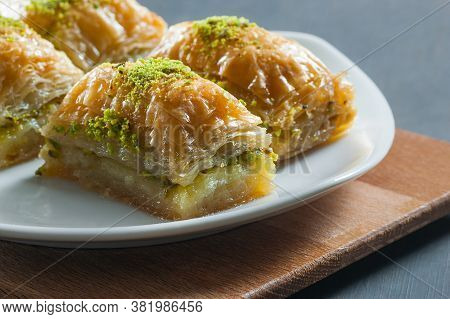 Traditional Turkish Dessert Antep Baklava With Pistachio On White Plate. Desserts Concept
