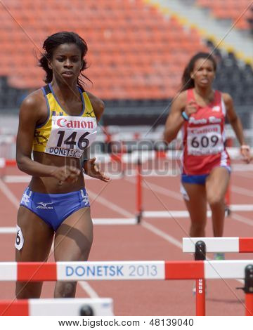 DONETSK, UKRAINE - JULY 11: Belle, Barbados (left) and Etanislao, Puerto Rico compete in semi-final of 400 m hurdles during 8th IAAF World Youth Championships in Donetsk, Ukraine on July 11, 2013