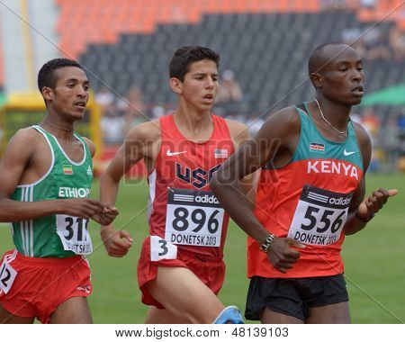 DONETSK, UKRAINE - JULY 11: Amibelu, Ethiopia (left), Fisher, USA (center), and Kibiego, Kenya compete in heat on 1500 m during 8th IAAF World Youth Championships in Donetsk, Ukraine on July 11, 2013