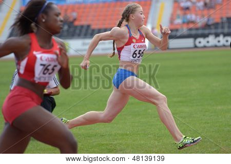 DONETSK, UKRAINE - JULY 11: Iuliia Sokolova, Russia (right) and Mikiah Brisco, USA compete in semi-final of 100 m hurdles during 8th IAAF World Youth Championships in Donetsk, Ukraine on July 11, 2013