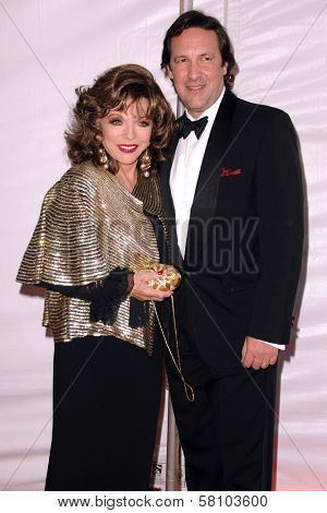 Joan Collins and Percy Gibson at the 2007 World Magic Awards to benefit Feed The Children. Barker Hangar, Santa Monica, CA. 10-13-07