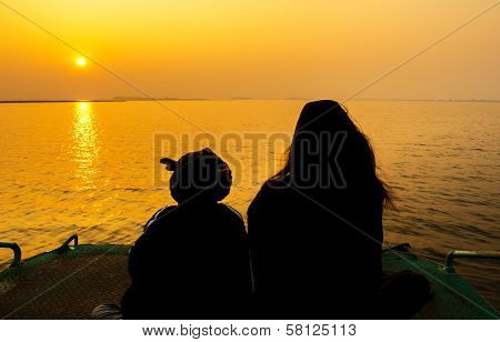 silhouette mother and son