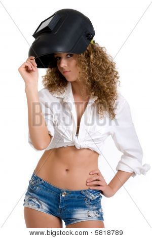 Beautiful curly girl in welder mask