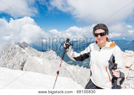 Young Woman Ascending A Mountain
