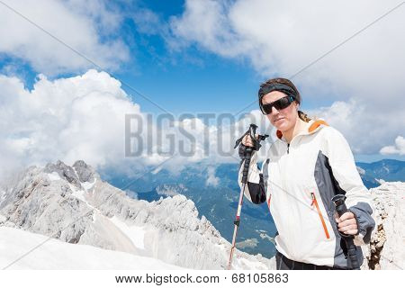 Young Woman Ascending A Mountain