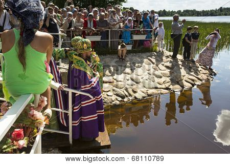 KRASNY BRONEVIK, RUSSIA - JULY 7, 2014: Celebrations commemorating the Rev. Anthony Dymsky (died 1224) in Antony Dymsky Monastery - Procession on Lake Dymsky, the great blessing of water and bathing.