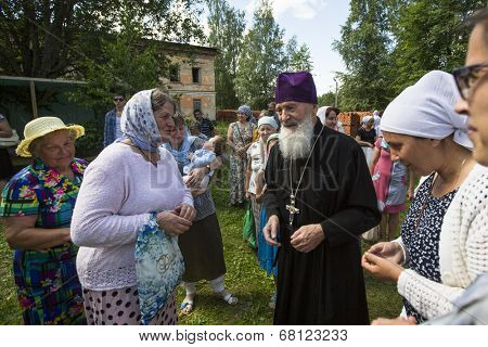 KRASNY BRONEVIK, RUSSIA - JULY 7, 2014: Celebrations commemorating the Rev. Anthony Dymsky (died 1224) in Antony Dymsky Monastery - Procession on Lake Dymsky, the great blessing of water and bathing.