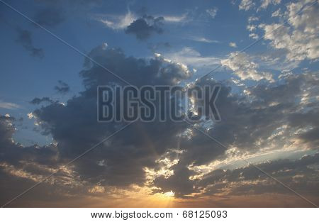 Cloudscape With The Sun Rays Radiating From Behind The Cloud