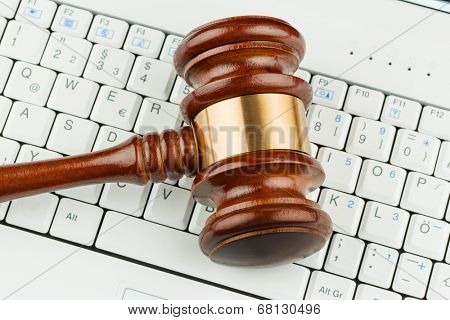 judge gavel on computer keyboard, symbolic photo for e-commerce and consumer protection