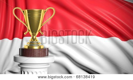 Golden trophy with Monacan flag in background 