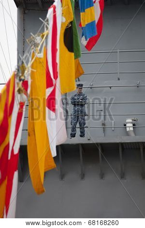 NEW YORK - MAY 22: Armed U.S. Navy personnel patrol the amphibious dock landing ship USS Oak Hill (LSD 51) moored at Pier 92 for Fleet Week NY on May 22, 2014.