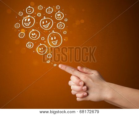 Group of happy hand drawed smiley faces coming out of gun shaped hands