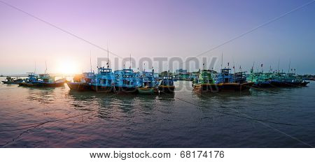 Vietnam, Phan Thiet, Mui Ne - fishing boats in harbor. Sunset photography