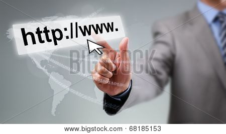 Businessman entering web page address on computer with cursor arrow, global communications and internet concept