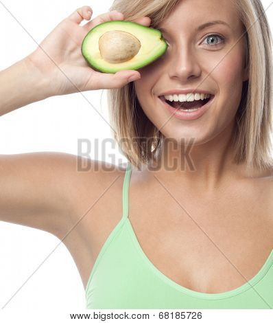 portrait of attractive  caucasian smiling woman isolated on white studio shot eating avocado