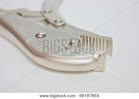 Close Up Of Locking Pliers With Opened Jaws.