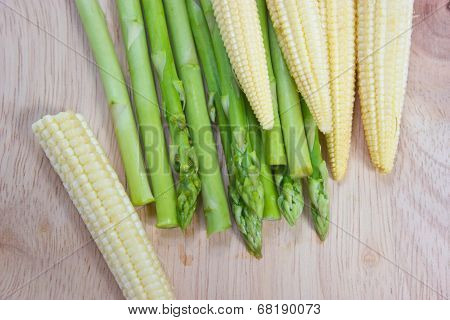 Asparagus And Baby Corn On Chopping Block.