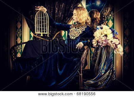 Beautiful fashion model in a rich historical dress. Vintage. Luxury style. 