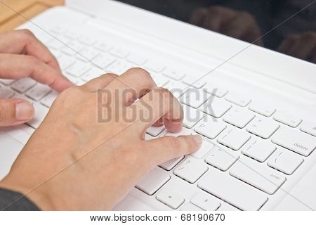 Hand Typing Laptop's Key Board.