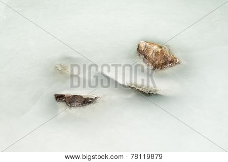 Stones In Silty Water