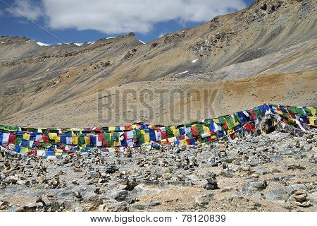 Colorful Buddhist Flags And Lot Of Stone Pyramids
