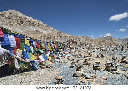 Stone Pyramids And Prayer Flags
