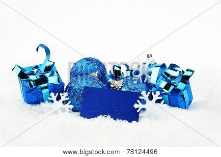 Blue Christmas Decoration With Wishes Card On Snow