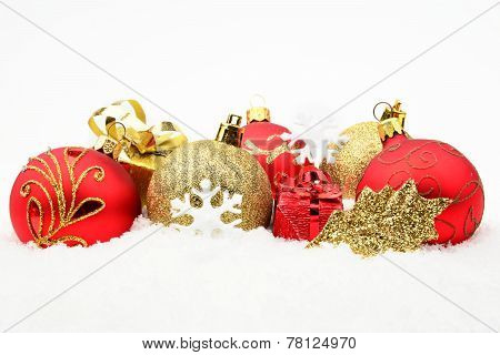 Golden,red Christmas Decoration On Snow
