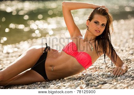Preety Woman In Swimsuit Near Alpine River In Early Summer