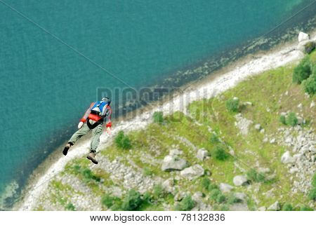 BASE jump off a cliff.