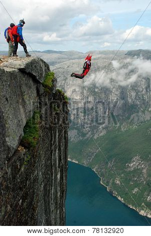 BASE jump off a cliff.