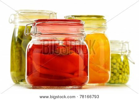 Jars With Pickled Vegetables And Fruity Compotes On White