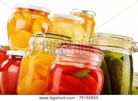 Jars With Pickled Vegetables, Fruity Compotes And Jams Isolated