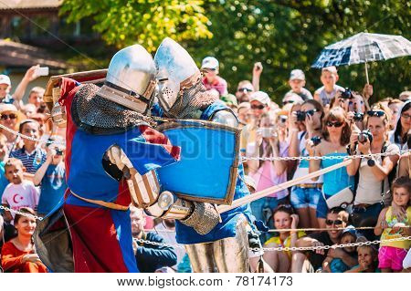 Knights In Fight With Sword. Restoration Of Knightly Battle