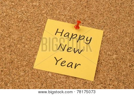 Happy New Year on a yellow sticky note