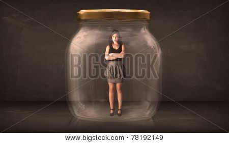 Businesswoman captured in a glass jar concept concept on background